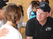 Turnabout's Dr. Hinckley speaks with a mother and daughter at one of Turnabout's activities